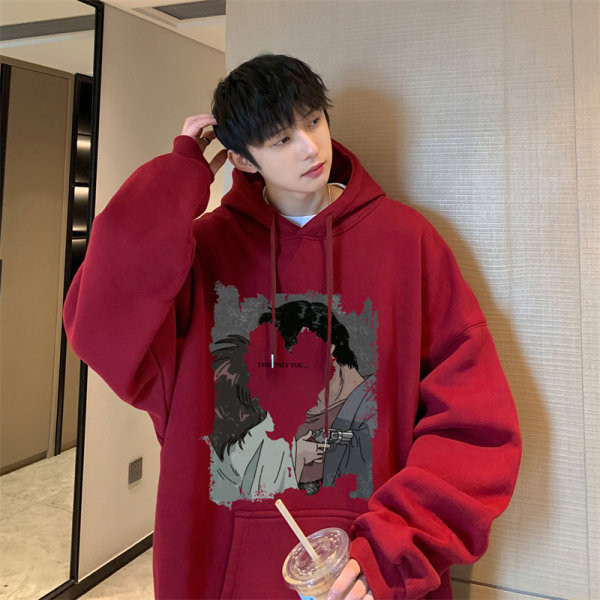 Széles modell férfi pulóver zsebbel és színes mintával