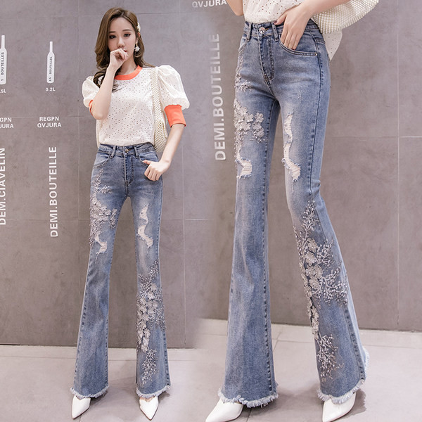 Moteriški džinsai – aukštu juosmeniu ir siuvinėjimais