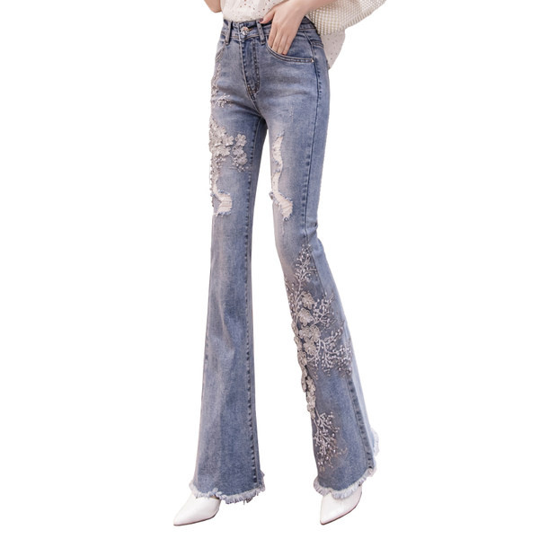 Moteriški džinsai – aukštu juosmeniu ir siuvinėjimais