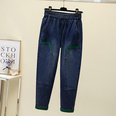 Moteriški džinsai su žaliu elementu ir tamprėmis