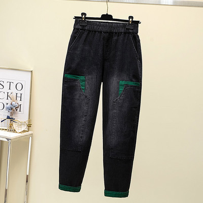 Moteriški džinsai su žaliu elementu ir tamprėmis