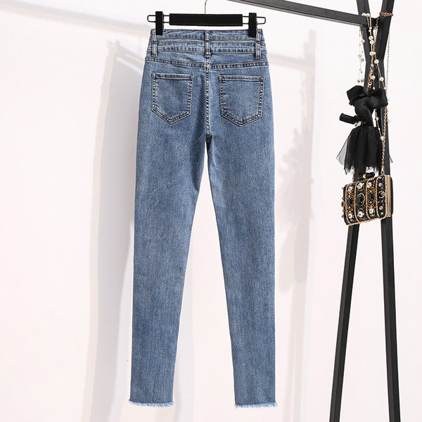 Női, magas derekú szakadt mintás karcsúsított farmernadrág