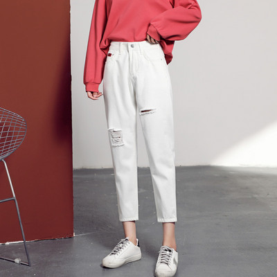 Kõrge vöökoha ja rebitud efektiga naiste teksad