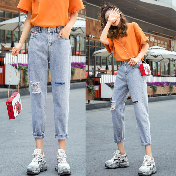 Kõrge vöökoha ja rebitud efektiga naiste teksad