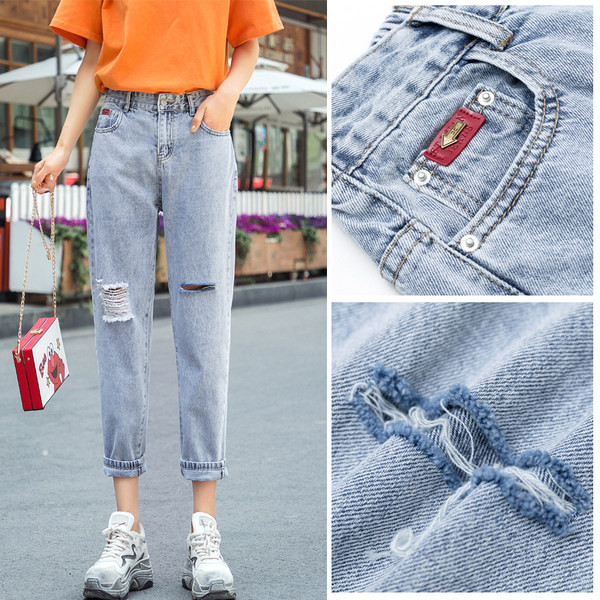 Kõrge vöökoha ja rebitud efektiga naiste teksad