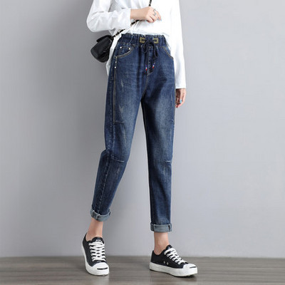 Női farmer zsebbel és nyakkendővel