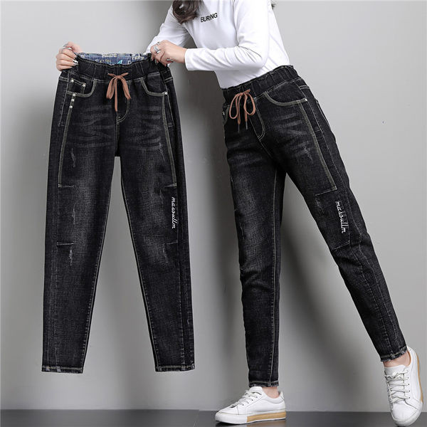 Női farmer zsebbel és nyakkendővel