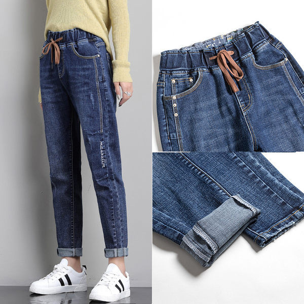 Női farmer zsebbel és nyakkendővel