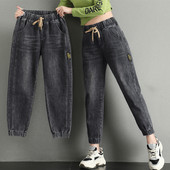 Naiste teksad kõrge vöökohaga lipsudega ja kummiga säärtes