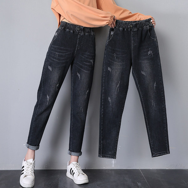 Női széles szárú farmer szakadt motívumokkal, gombos rögzítéssel