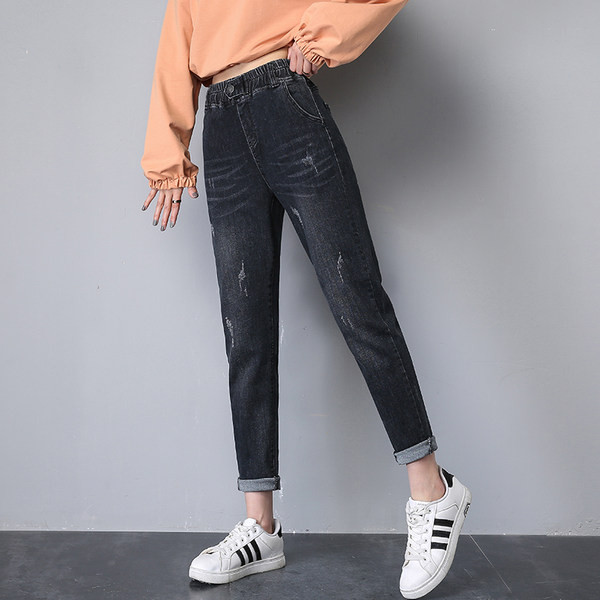 Női széles szárú farmer szakadt motívumokkal, gombos rögzítéssel