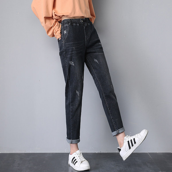 Női széles szárú farmer szakadt motívumokkal, gombos rögzítéssel