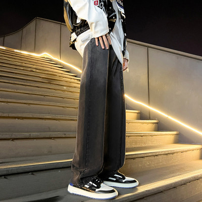 Dviejų spalvų vyriški džinsai su plėšytais motyvais