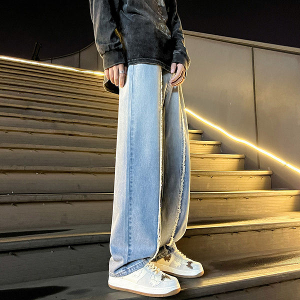 Dviejų spalvų vyriški džinsai su plėšytais motyvais