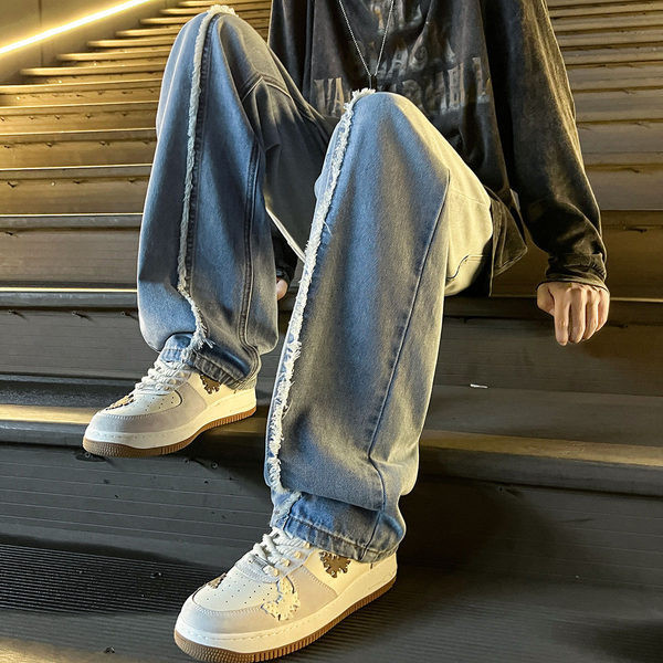 Dviejų spalvų vyriški džinsai su plėšytais motyvais