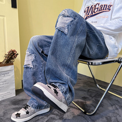 Férfi farmer fűzős, szakadt motívumokkal