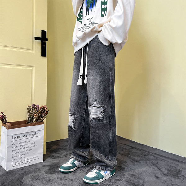 Férfi farmer fűzős, szakadt motívumokkal