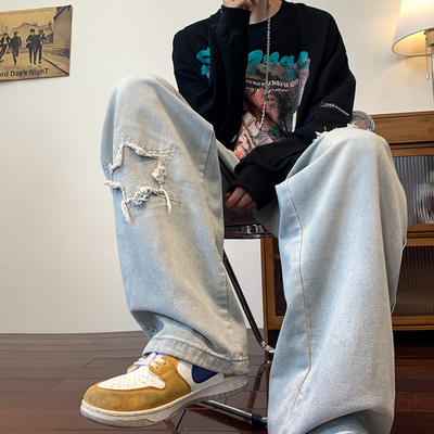 Ανδρικό φαρδύ τζιν με σκισμένα μοτίβα