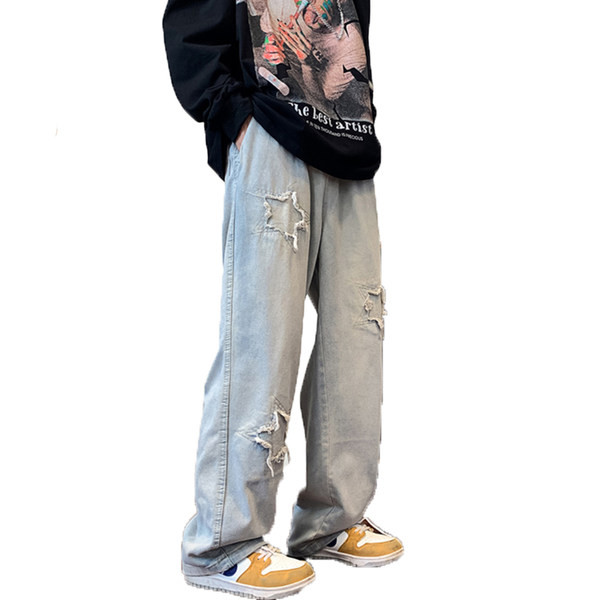 Ανδρικό φαρδύ τζιν με σκισμένα μοτίβα