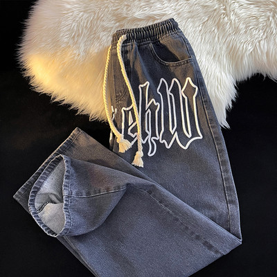 Мъжки дънки с бродиран надпис и връзки