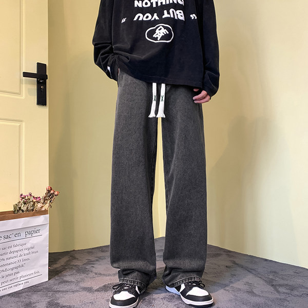 Vyriški džinsai su raišteliais ir plačiomis kojomis