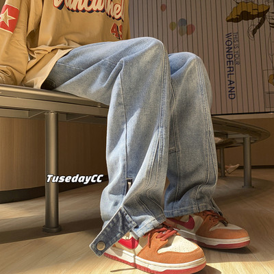 Vyriški plataus modelio džinsai su užtrauktuku ir sagute ant kojų