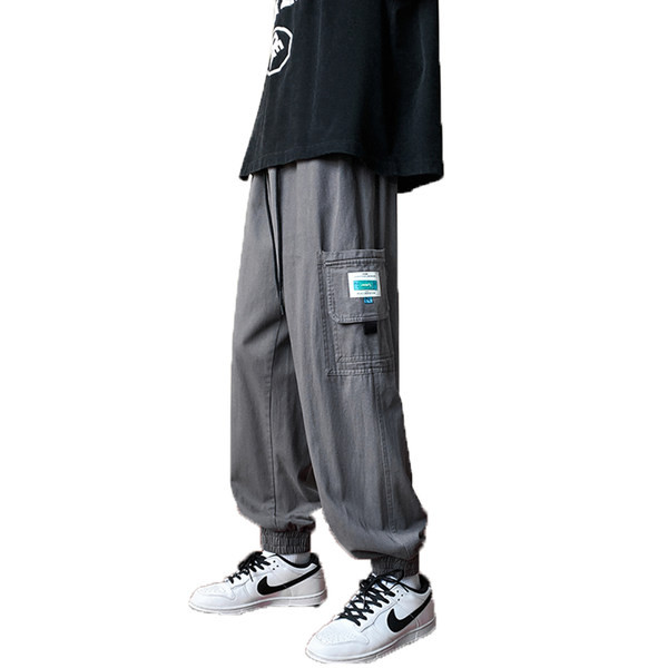 Meeste püksid logoga paelte ja küljetaskuga