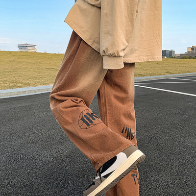 Vyriški džinsai su kišenėmis ir užrašu