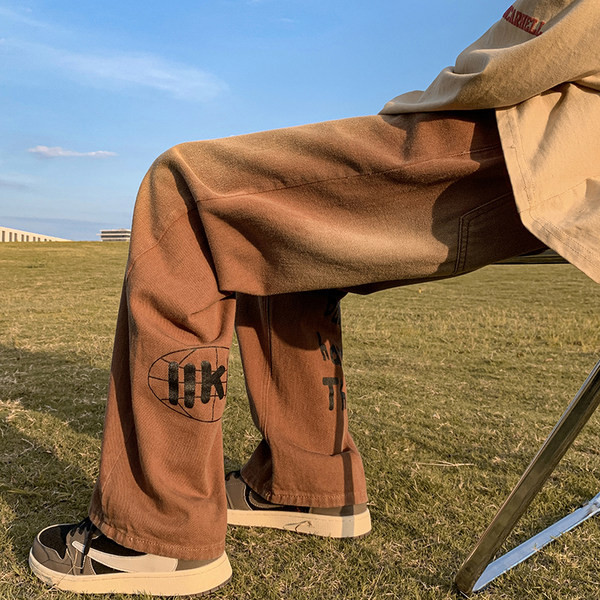 Vyriški džinsai su kišenėmis ir užrašu