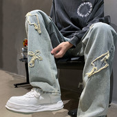 Vyriški laisvalaikio džinsai su mėlynos spalvos siuvinėjimais