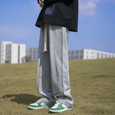 Férfi farmer széles szárral és gombokkal, felirattal