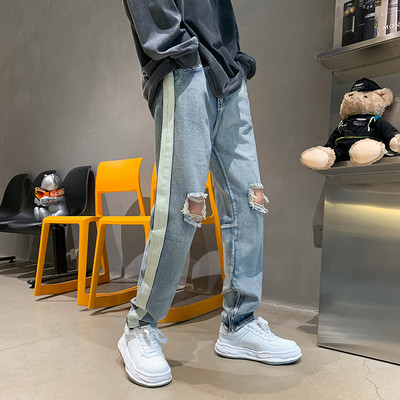 Vyriški džinsai su dekoratyviniu užtrauktuku ir karpytų motyvų