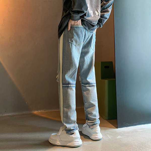 Vyriški džinsai su dekoratyviniu užtrauktuku ir karpytų motyvų