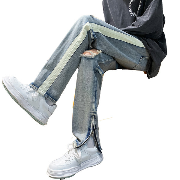 Vyriški džinsai su dekoratyviniu užtrauktuku ir karpytų motyvų