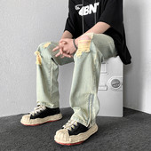 Dviejų spalvų vyriški džinsai su kirptais motyvais