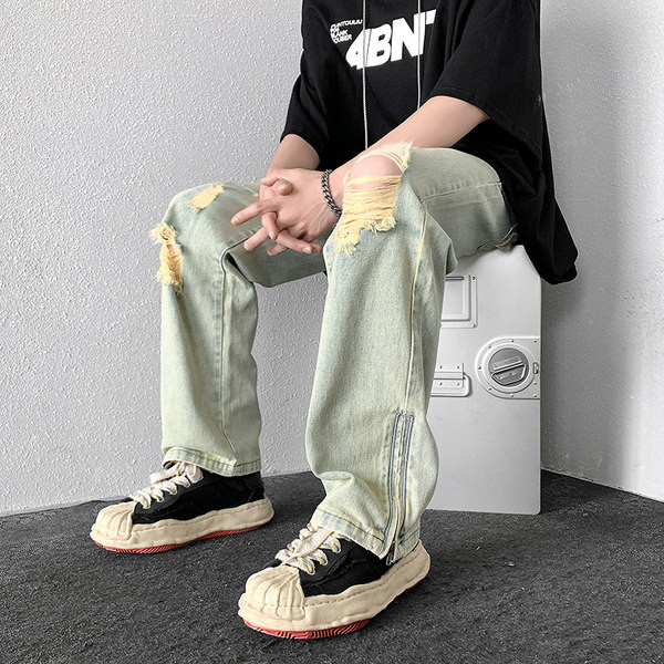 Dviejų spalvų vyriški džinsai su kirptais motyvais