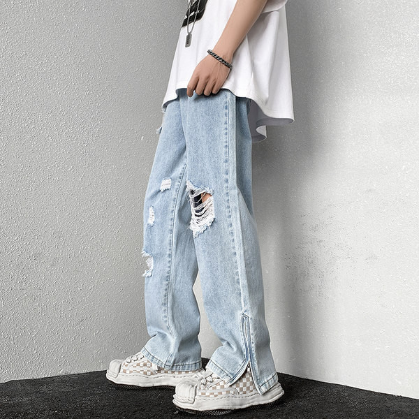 Dviejų spalvų vyriški džinsai su kirptais motyvais