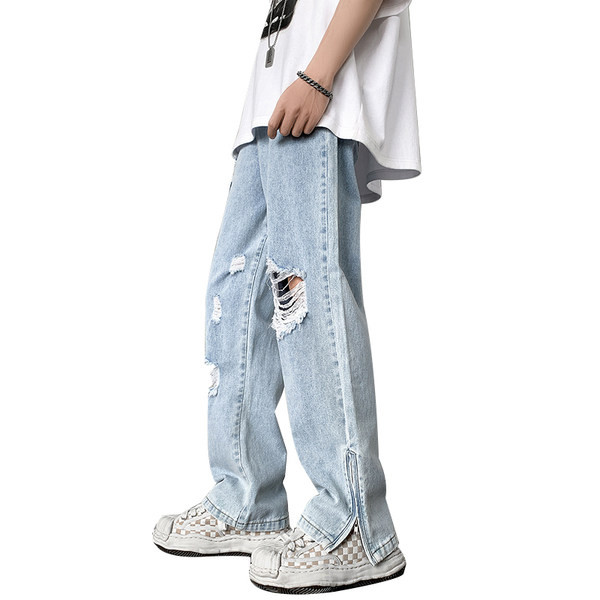 Dviejų spalvų vyriški džinsai su kirptais motyvais