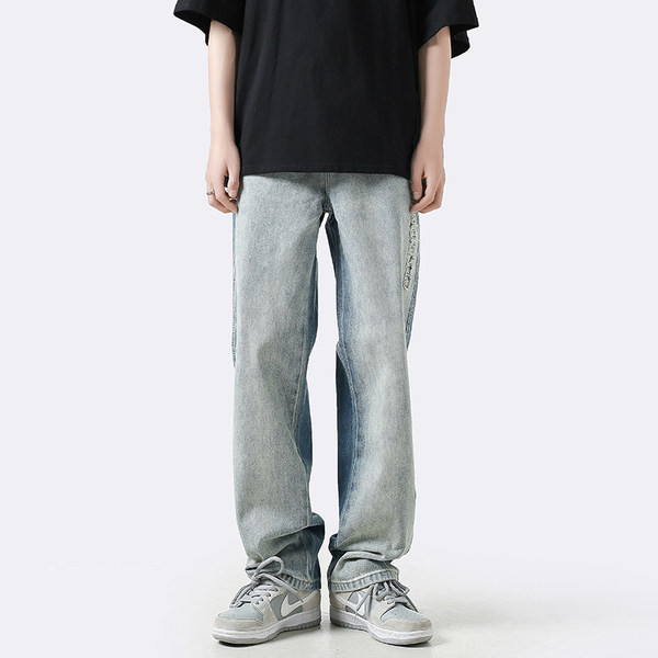 Ανδρικό φαρδύ τζιν με σκισμένα μοτίβα