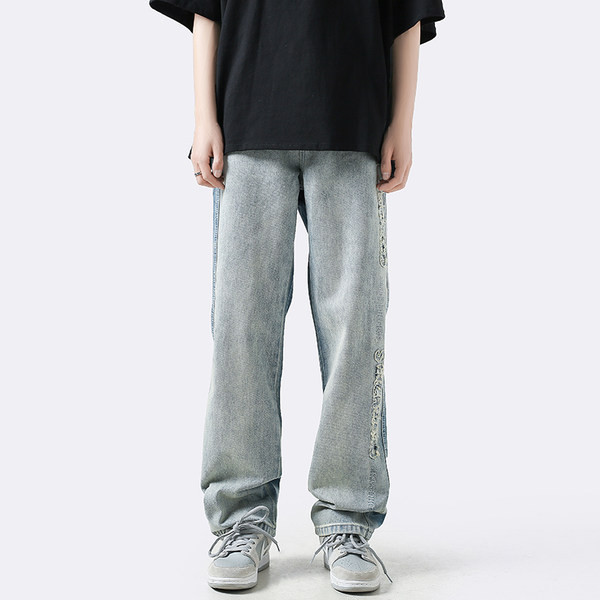 Ανδρικό φαρδύ τζιν με σκισμένα μοτίβα