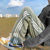 Vyriški džinsai plačiomis blauzdomis su raštu ir raišteliu