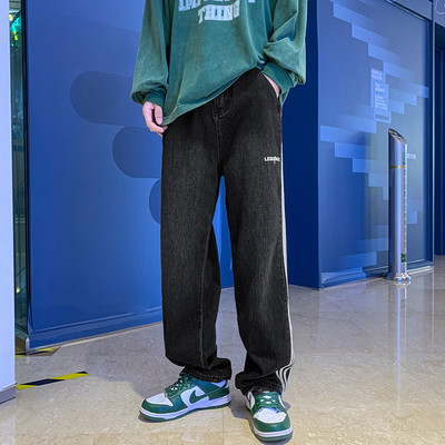 Vyriški džinsai plačiomis blauzdomis su raštu ir raišteliu