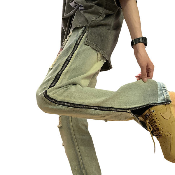 Modern férfi farmer, oldalsó cipzárral, szakadt motívumokkal