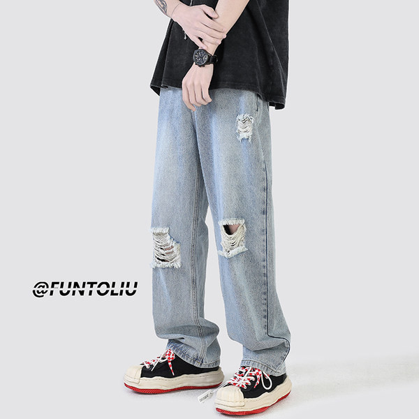 Ανδρικό τζιν με φαρδιά εφαρμογή με τσέπη και σκισμένα μοτίβα