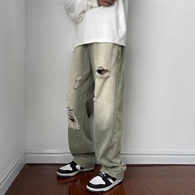 Férfi magas derekú farmer, szakadt motívumokkal