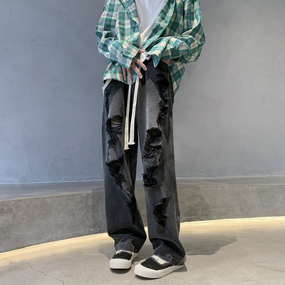 Széles szabású férfi farmer fűzős, szakadt motívumokkal