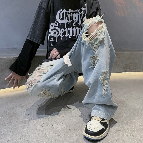 Széles szabású férfi farmer fűzős, szakadt motívumokkal