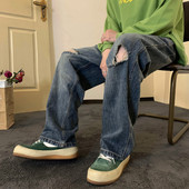 Férfi farmer zsebbel, szakadt motívumokkal