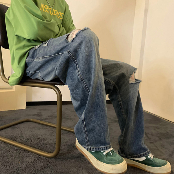 Férfi farmer zsebbel, szakadt motívumokkal