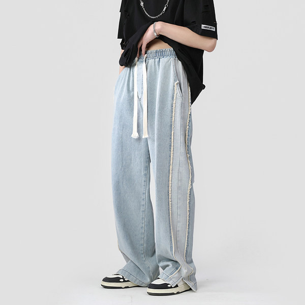 Széles modell férfi farmer fűzővel és hasítékkal a szárán